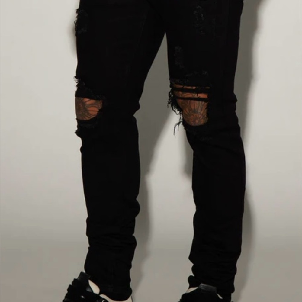 Ripped black designer Mnml jeans